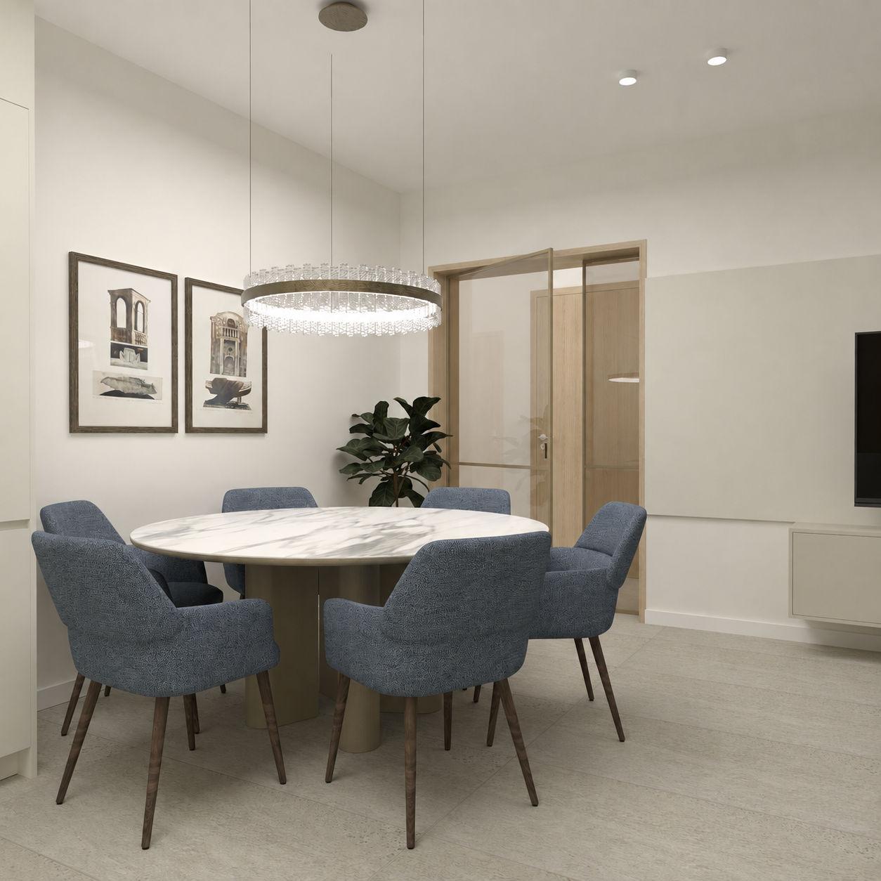 Round dining table under a ring pendant